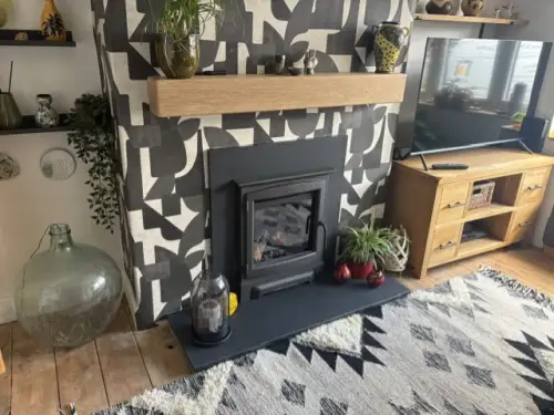CALLEOS GLASS FRONTED FIRE WITH A CAST IRON STOVE FASCIA